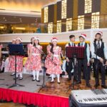 Carolers from Children’s Hope Foundation entertaint he guests during Century Park Hotel’s Annual Tree Lighting event